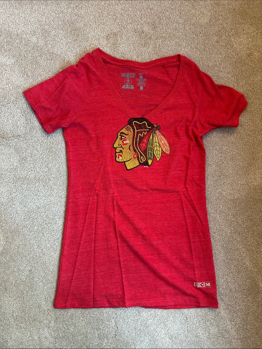 CCM Red V-Neck Tee with Multi-Color Native Head Logo